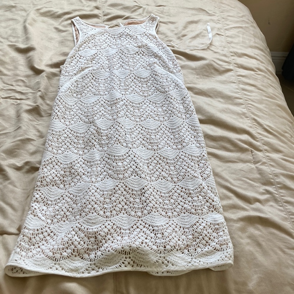 white dress lined to go out on a sunny day